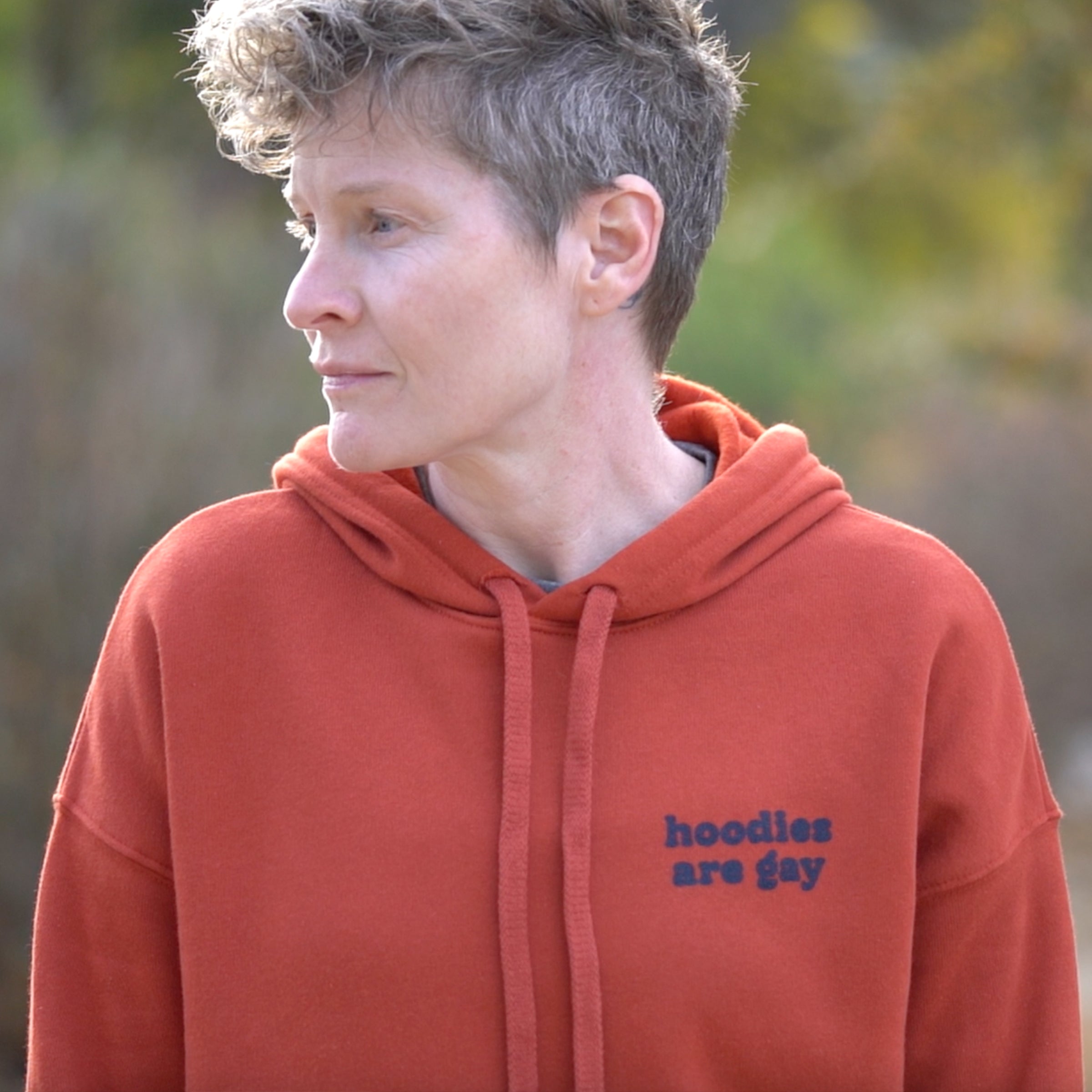 Hoodies Are Gay pullover hoodie styled on model — gender neutral LGBTQ+ queer clothing
