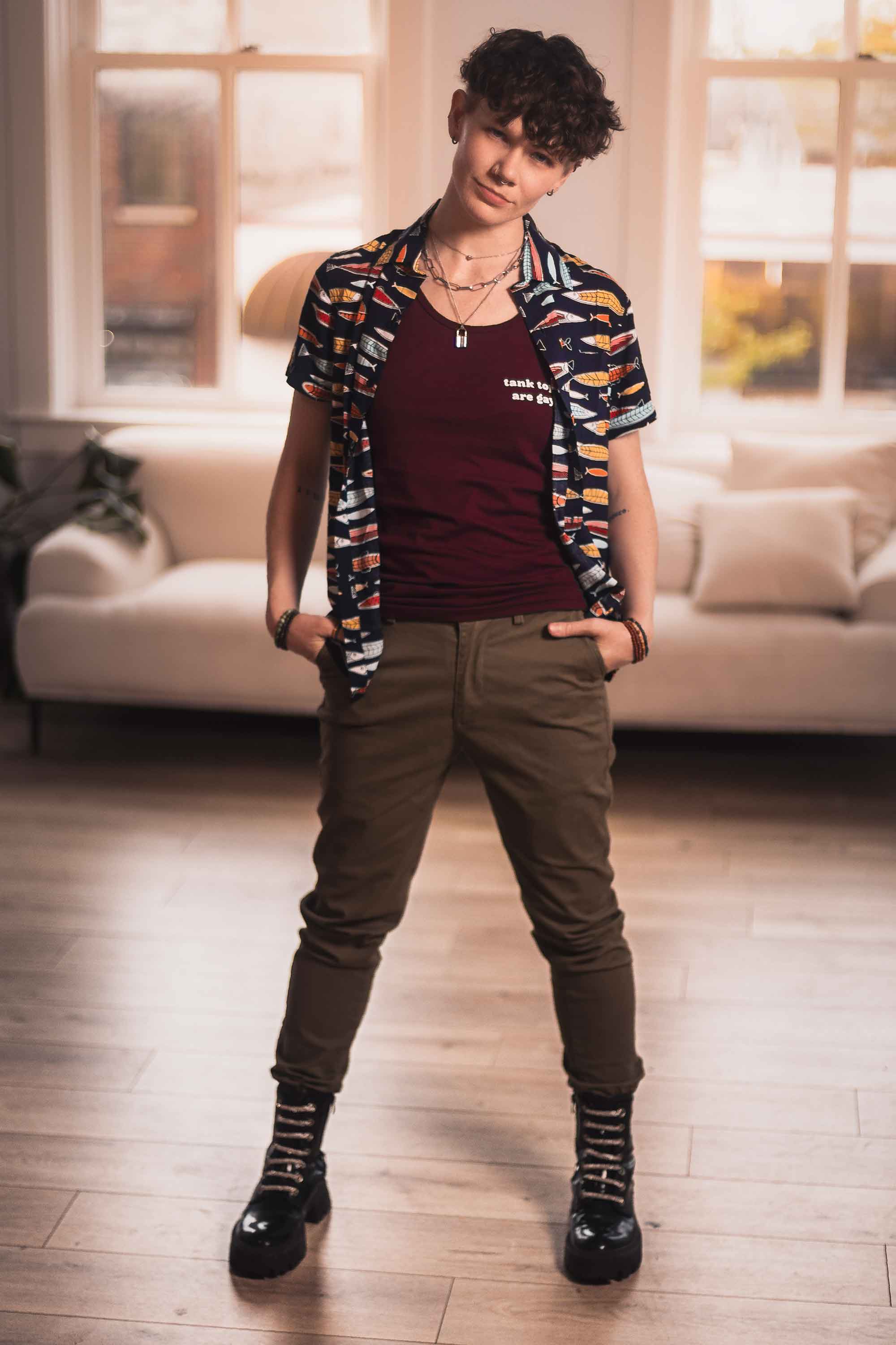 Army joggers styled with a tank top — gender neutral outfit for queer and masc style