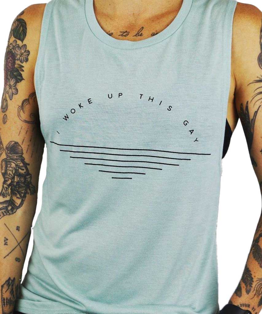 Model wearing, I woke up this gay dusty blue flowy muscle tank