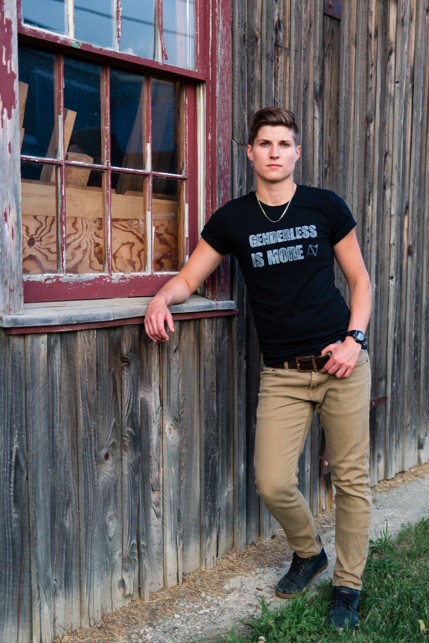 Genderless Is More crew neck in Black on model — gender neutral queer clothing for non-binary style