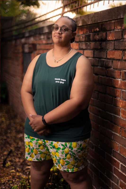 Tank Tops Are Gay tank top on model with shorts — LGBTQ+ gender neutral clothing