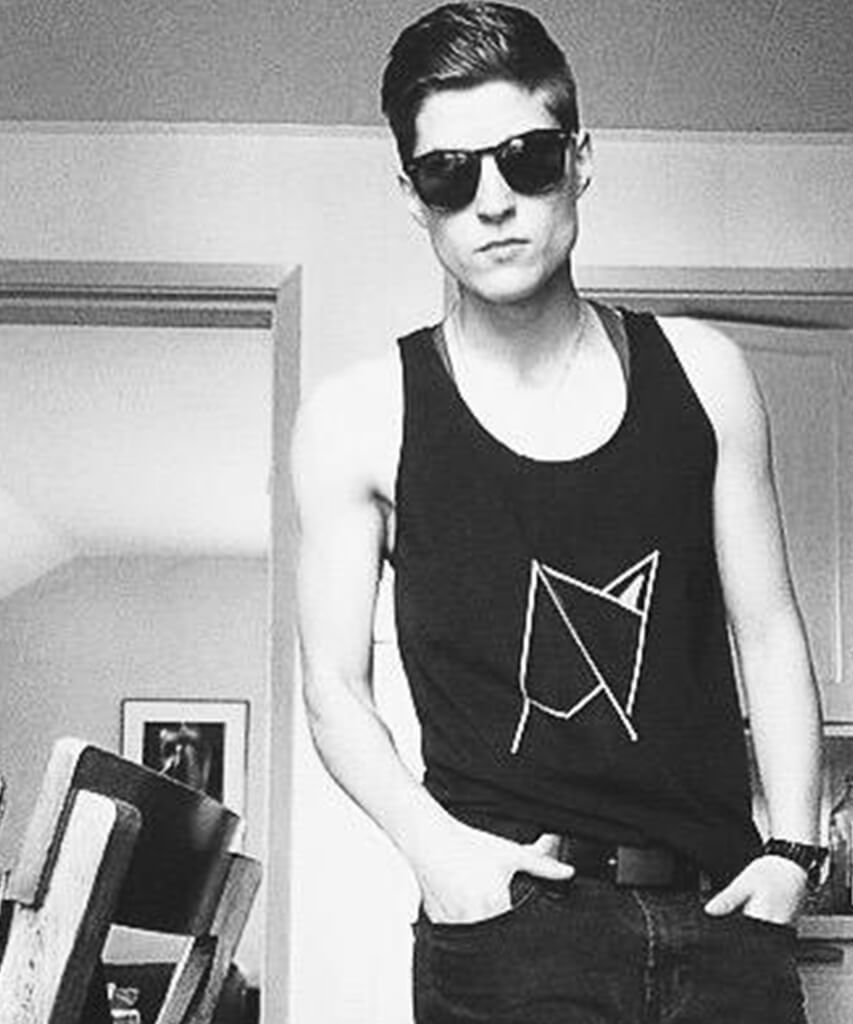 Androgynous Fox logo tank top on model — gender neutral queer clothing for non-binary style
