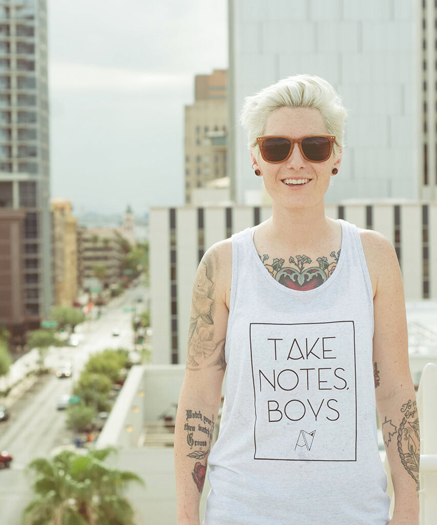 Take Notes Boys tank top in White Speckle on model — queer gender neutral graphic tank