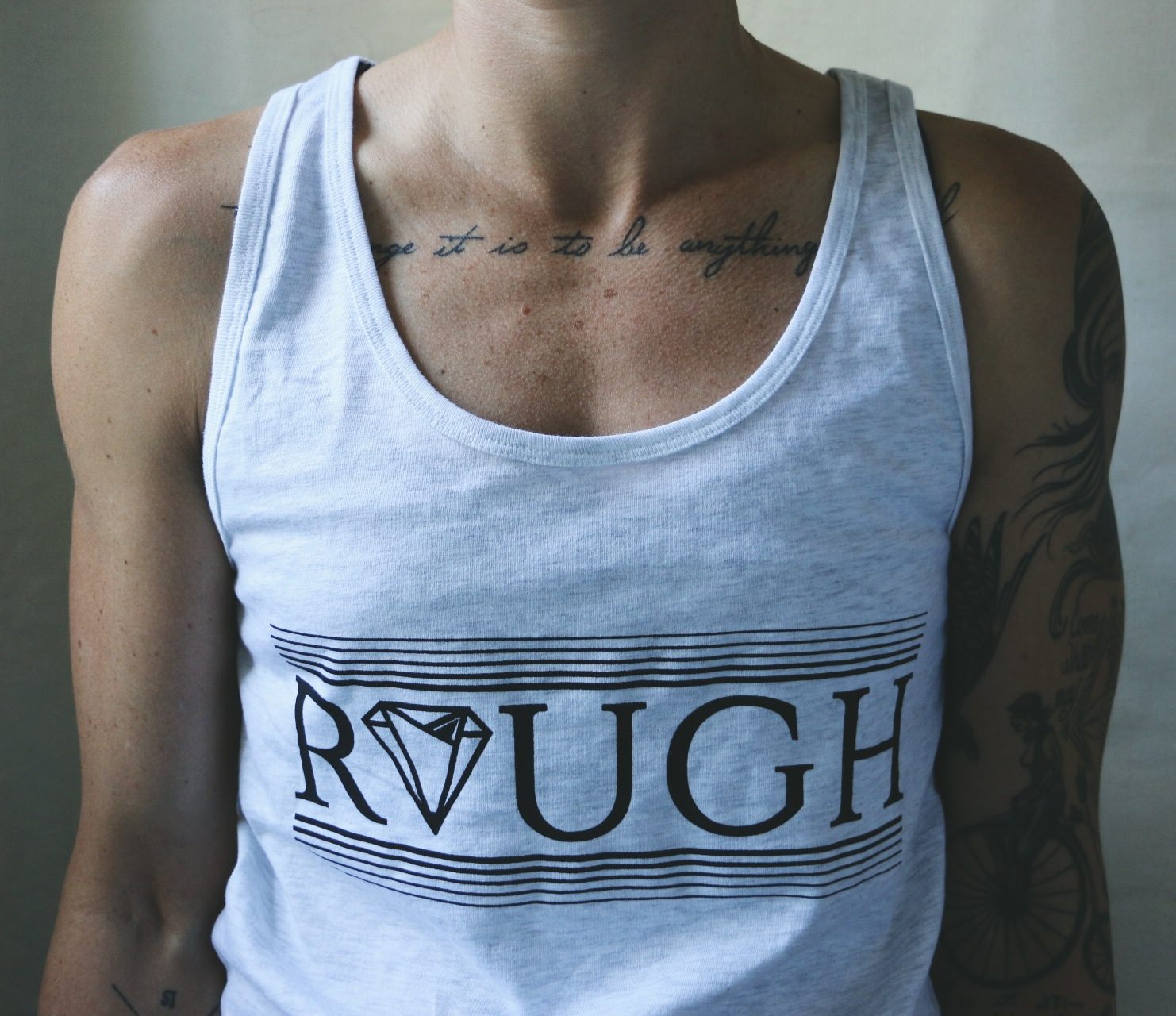 Diamond In The Rough tank top in White Speckle on model — gender neutral queer tank top