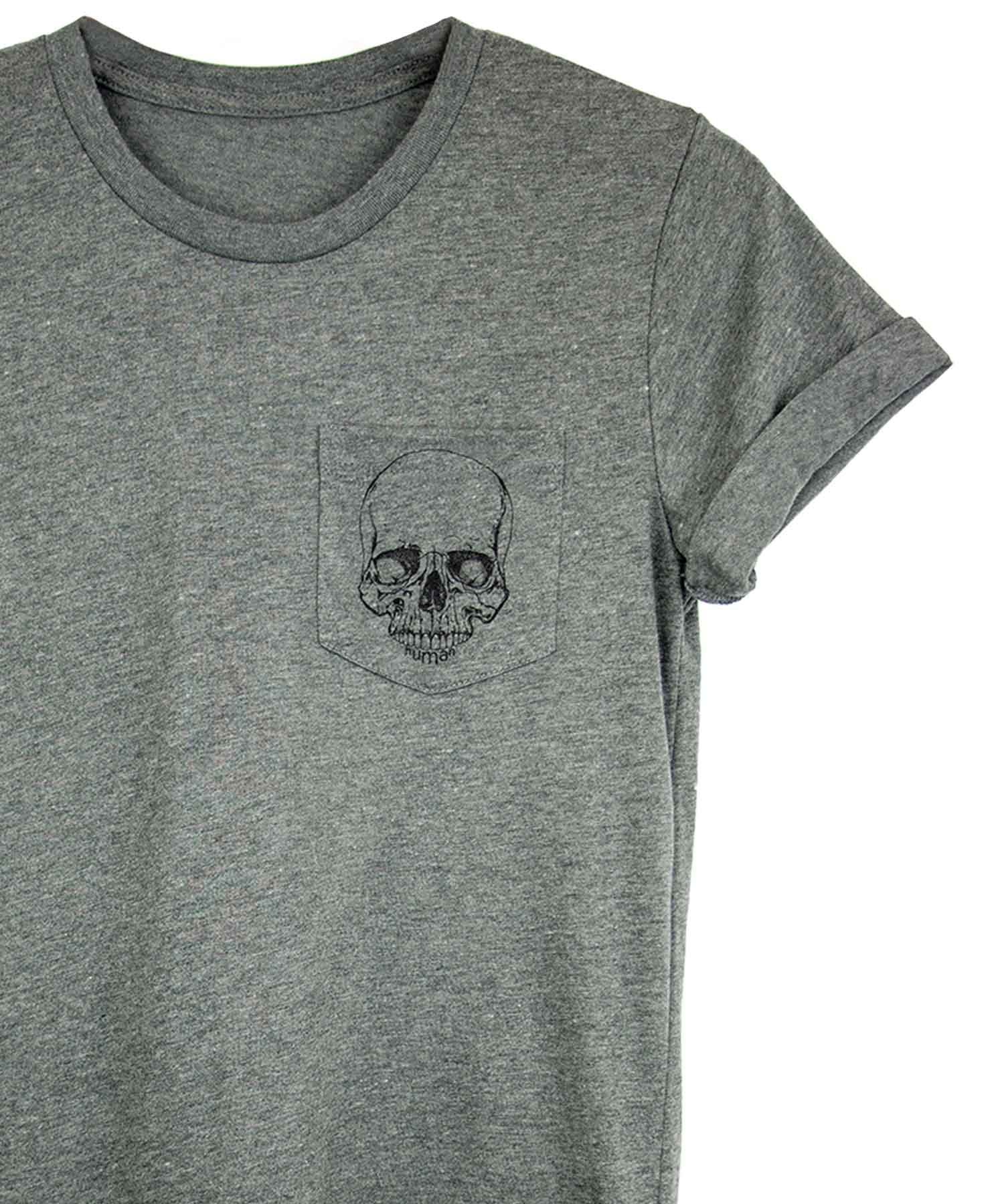 Androgynous Fox grey crew neck pocket tee with skull printed in black ink on the pocket. 